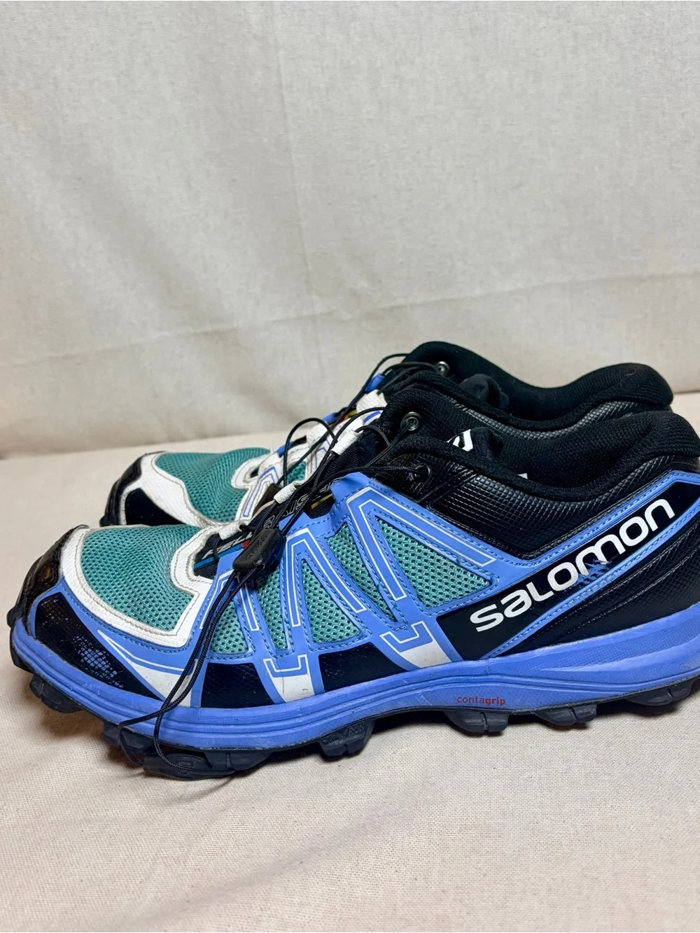 Salomon woman’s Sneakers in Teal, Blue, White and Black size 10